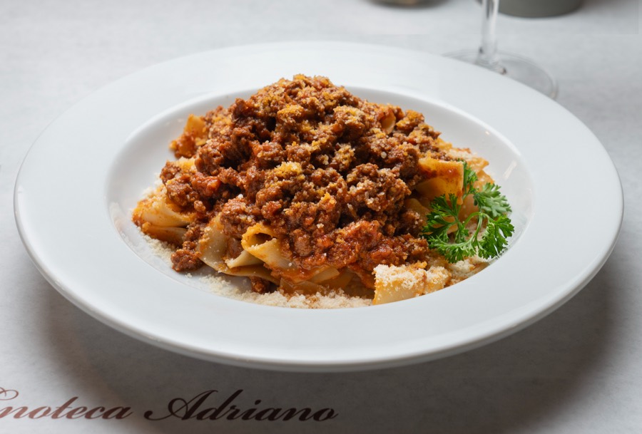 A bowl of pappardelle with ragu at Enoteca Adriano