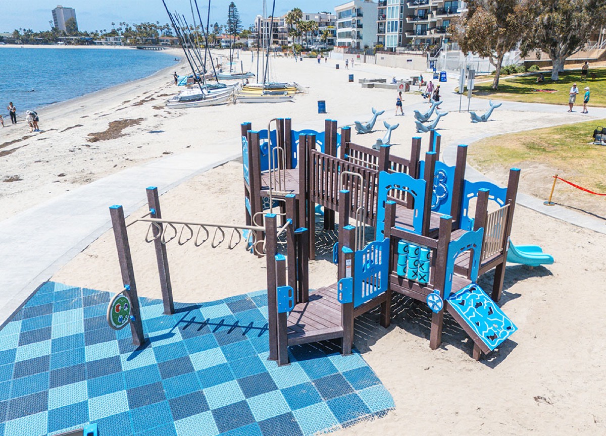 The playground and the calm bay water at Fanuel Street Park