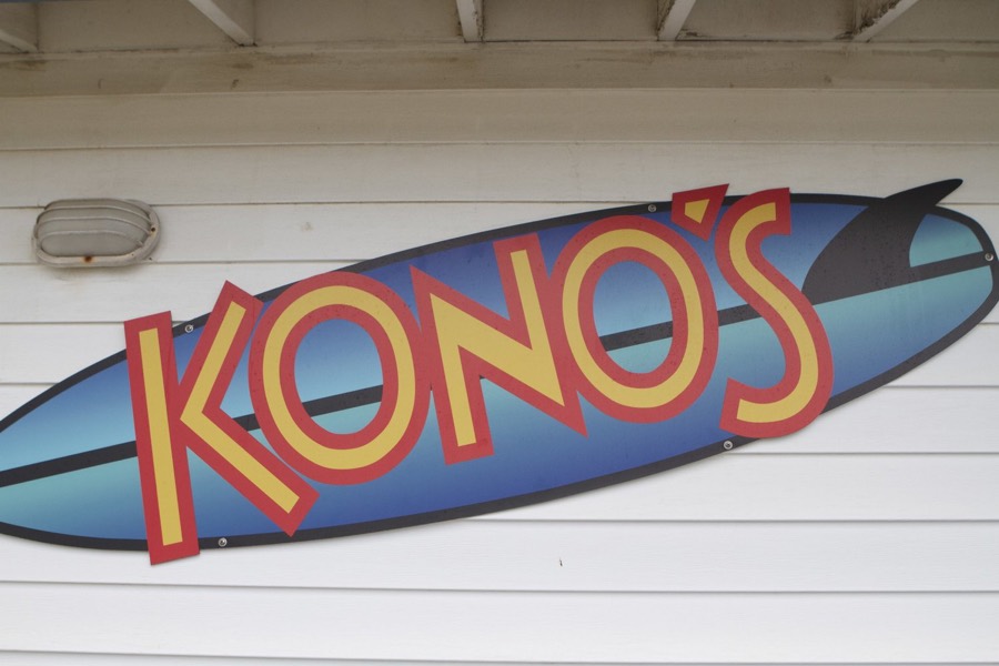 The painted surfboard sign outside Kono's Cafe