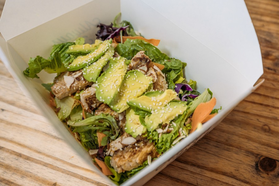 A takeout box of salad from Oscar's Mexican Seafood