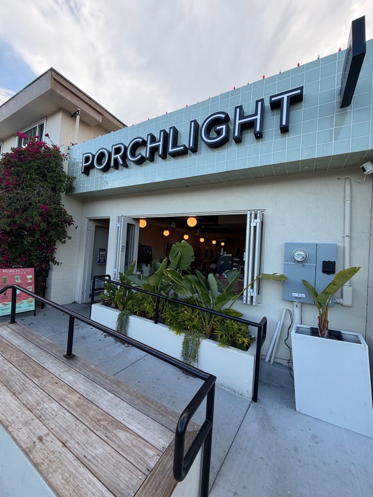 The PorchLight Coffee storefront on Cass Street, with a ramp up to the open front window