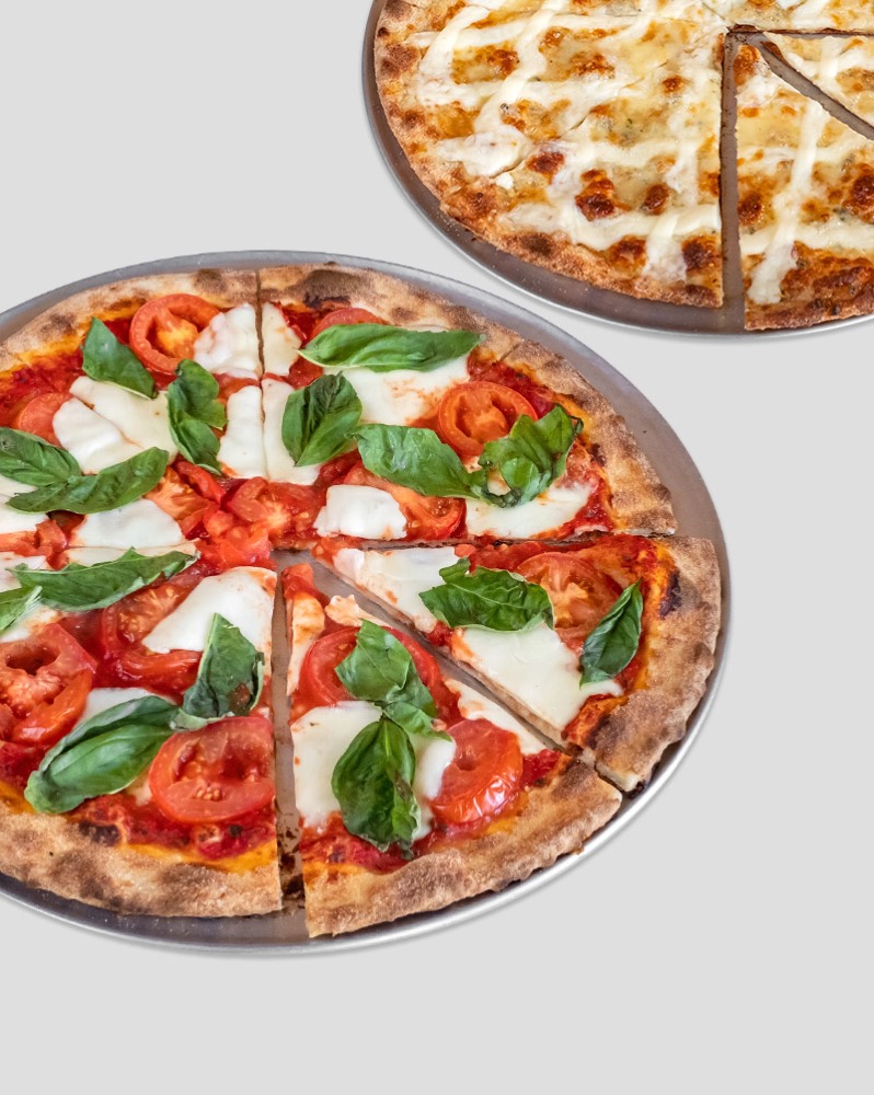 A margherita pizza with fresh basil from Theo's Hot Pizza